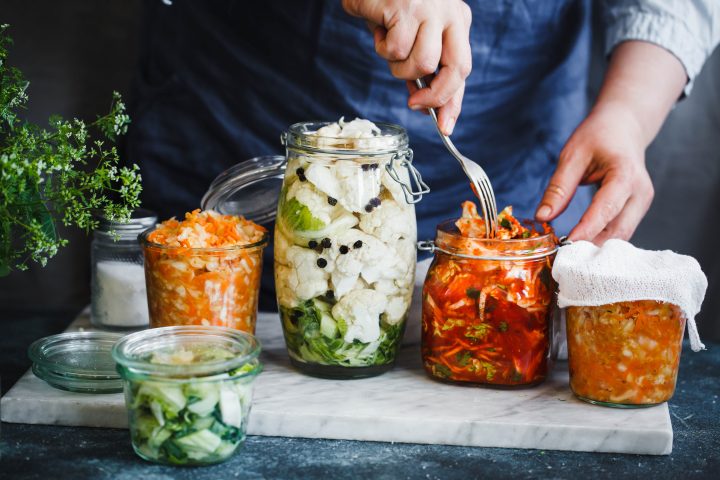 Fermented-preserved-vegetarian-food-concept-Cabbage-kimchi-broccoli-marinated-sauerkraut-sour-glass-